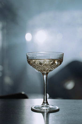 champagne glass, crystal glass, bubbles, elegant drink, soft lighting, stylish setting, sunlight, drink photography, glassware, champagne bubbles, elegant glass