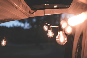 car lights, string lights, cozy ambiance, evening lights, glowing lamps, car interior, vehicle lights, warm lighting, garland of glow, vehicle string lights, evening car lights