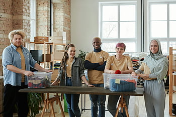 volunteers, loft, donations, clothing donations, organized workspace, community support, diverse team, sorting donations, volunteer work, charity, non-profit