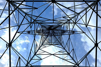 steel power pylon, low angle photograph, black metal tower, bright blue sky, daytime, satellite, power lines, steel structure, electrical tower, sky view, power transmission