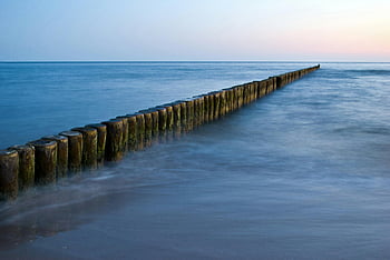 Ostsee, Buhnen, Sonnenuntergang, stille Wasser, Pastellhimmel, Friedliche Aussicht, Holzweg, Meereslandschaft, Langzeitbelichtung, Naturlandschaft, Küstenszene