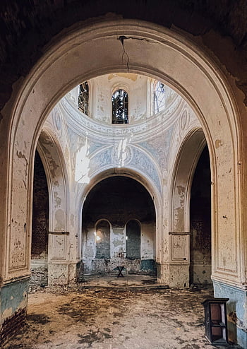 abandoned Ukrainian church, gothic architecture, arch shaped windows, brown concrete building, haunting beauty, interior view, old church, abandoned building, gothic windows, architectural ruins, abandoned interior