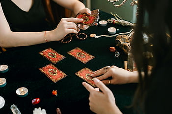 tarot cards, mystical atmosphere, tarot reading, crystals, candles, deck of tarot cards, tarot session, mystical setting, tarot card reading, mystical ambiance, tarot cards and crystals
