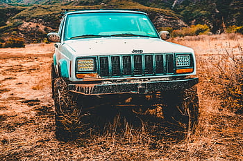 Jeep, SUV, mud-splattered, dirt road, adventure themes, front view, off-road, rugged, outdoor, vehicle, exploration