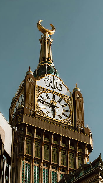 Mecca Clock Tower, Arabic script, low angle shot, iconic clock tower, Mecca Saudi Arabia, clear sky, stunning view, Islamic architecture, Abraj Al Bait, Makkah, Saudi Arabia