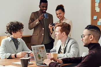 diverse professionals, brainstorming ideas, indoor meeting, group discussion, business people, collaborative work, office environment, professional meeting, team interaction, workplace collaboration, diverse team