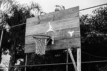 basketball court, hanging hoop, park, black and white, rustic wooden hoop, outdoor court, fence, sports, recreation, Jordan logo, net