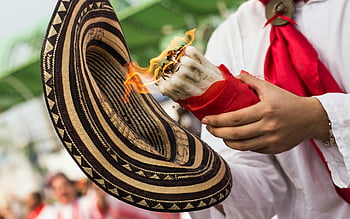 Barranquilla Carnival, traditional hat, burning candle, red cloth, close-up, man, festival, cultural event, Colombian culture, celebration, costume