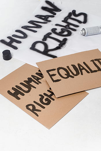 cardboard placards, spray paint, protest signs, human rights, equality, close-up, advocacy, demonstration, social justice, activism, cardboard signs