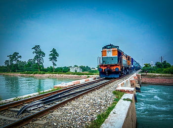 train, trees, blue sky, bridge, serene river, lush landscape, railway, travel, nature, outdoor, transportation