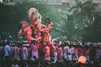 Ganesha statue, Ganesh Chaturthi, Mumbai, colorful crowds, celebration, festival, grand statue, Indian festival, religious event, cultural celebration, elephant god
