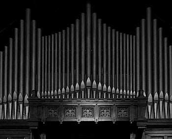 grayscale, piano keys, grand pipe organ, black and white, intricate design, organ pipes, detailed photograph, musical instrument, classical music, organ music, organist