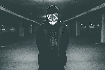 man wearing hood, mask with neon lights, glowing mask, dimly lit setting, eerie indoor, person in hoodie, neon light mask, dark environment, mysterious figure, hooded individual, glowing eyes