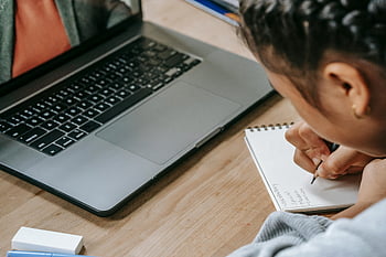 ethnic girl, online education, laptop, taking notes, notebook, child studying, online learning, home study, focused student, educational technology, remote learning