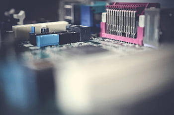 motherboard, closeup photography, circuit board, electronic components, soft focus, detailed close-up, computer hardware, technology, microelectronics, PCB, computer parts