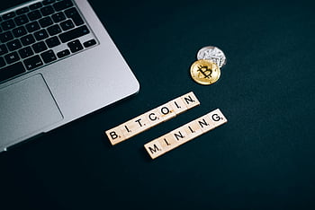 Bitcoin mining, Scrabble tiles, laptop keyboard, top view, cryptocurrency concept, digital currency, mining process, financial technology, tech setup, table arrangement, Bitcoin coins