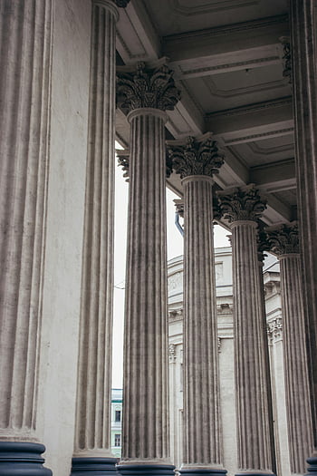 Ancient Greek Pillars, White columns, Shabby columns, Saint Petersburg, classic stone columns, intricate carvings, vertical shot, architectural details, historical architecture, stone architecture, vertical composition