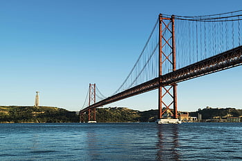 25 de Abril Bridge, suspension bridge, Tagus River, Lisbon, Portugal, stunning architecture, body of water, river, landmark, travel destination, bridge design