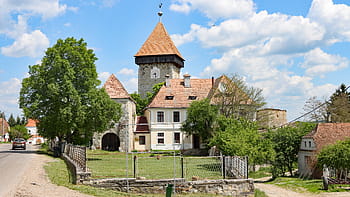 fortified church, Drăușeni, Romanesque style, 13th century, massive tower, Gothic elements, Saint Catherine mural, defensive wall, 15th century, 17th century, drawbridges