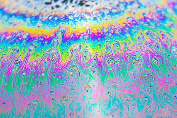 iridescent bubbles, vibrant colors, close-up photography, abstract patterns, soap bubbles, iridescent surface, colorful bubbles, unique patterns, bubble texture, macro photography, iridescent art