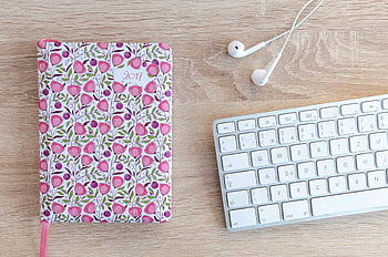 laptop keyboard, floral notebook, white earphones, wooden desk, top view, office workspace, workspace themes, desk setup, productivity desk, notebook design, keyboard layout