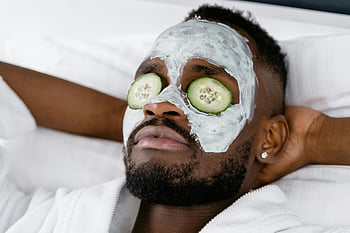man relaxing, face mask, sliced cucumber, self-care day, relaxation, facial treatment, cucumber slices, skincare routine, facial care, man with mask, eye relaxation
