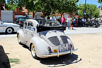Renault 4/CV, classic car, vintage vehicle, car show, Villaviciosa de Odon, Madrid, June 2024, outdoor event, people gathering, retro car, license plate