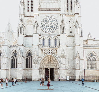 Bordeaux cathedral, Gothic architecture, people standing, stunning cathedral, cathedral entrance, Gothic windows, cathedral facade, Bordeaux France, cathedral visitors, cathedral square, cathedral exterior