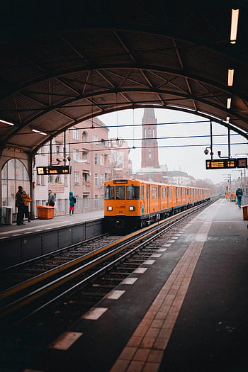 yellow train, Berlin station, urban transit, vibrant yellow, metro train, train station, arriving train, city transportation, train tracks, station platform, Berlin metro