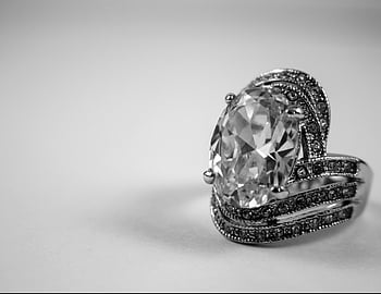 diamond ring, silver-colored ring, close-up, luxurious, intricate design, elegance, jewelry, gemstone, fine jewelry, engagement ring, wedding ring