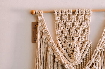 handmade macrame, beige macrame, wall hanging, intricate knots, macrame pattern, detailed view, macrame art, macrame decor, macrame design, macrame craft, macrame texture