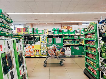 shopping cart, grocery store, supermarket aisle, Padova Italy, vibrant supermarket, grocery products, supermarket products, shopping trolley, store interior, retail environment, consumer goods
