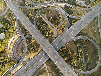 aerial photography, concrete road, highway interchange, Islamabad, modern urban infrastructure, greenery, aerial view, urban planning, transportation network, road design, infrastructure development