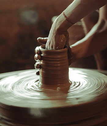 clay pot, pottery wheel, skilled craftsmanship, hands molding clay, Ilocos Philippines, traditional art, ceramic making, artisan work, pottery process, cultural craft, handmade pottery