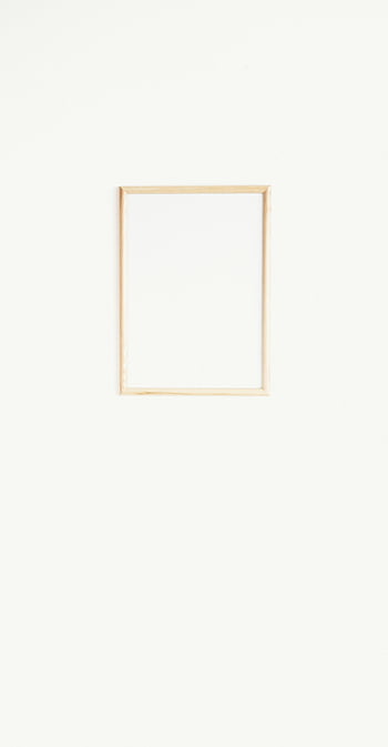 brown wooden frame, white wall, minimalist frame, copyspace, hanging frame, plain wall, empty frame, wooden picture frame, white background, simple design, wall decor