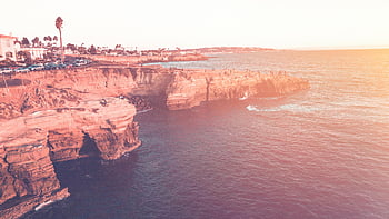 San Diego cliffs, ocean sunset, vibrant sunset, natural beauty, aerial capture, San Diego ocean, sunset cliffs, coastal sunset, ocean view, sunset landscape, San Diego landscape