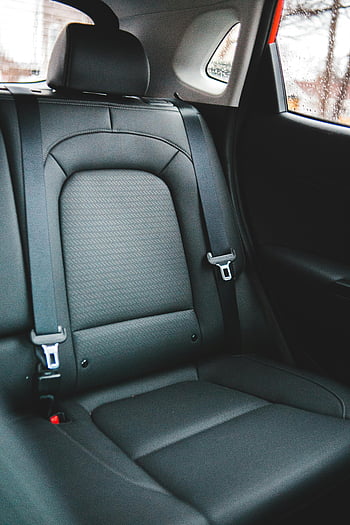 black leather car seat, modern car interior, elegant car backseat, seat belts, automotive design, car comfort, black leather seats, modern car seats, car backseat design, car interior comfort, car seat belts