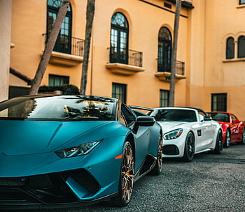 Blå Lamborghini, luksuriøse sportsbiler, parkert på gaten, jacksonville, by gate, rad av biler, lamborghini, sportsbiler, blå bil, urbane omgivelser, Luksusbiler