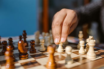chess, chess game, chessboard, chess pieces, hand moving piece, intense game moment, strategy game, board game, chess player, game of chess, chess strategy