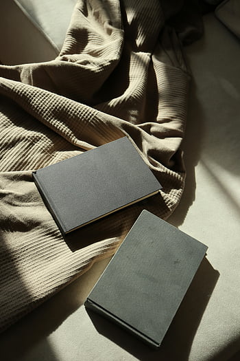 minimalist notebook, soft beige fabric, flat lay, design mockups, textured fabric, elegant display, minimalist design, notebook display, beige background, flat lay photography, minimalist photography