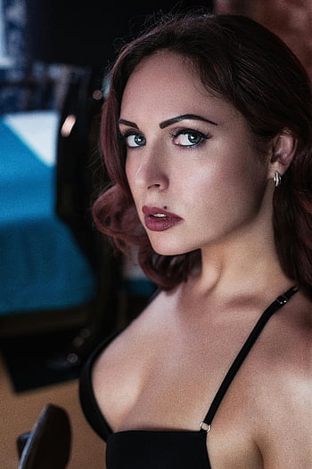 woman posing, fierce pose, confident look, stylish outfit, indoor setting, professional photography, dramatic lighting, elegant appearance, modern style, expressive eyes, bold makeup