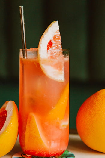 apelsinjuice, närbild skott, citrus dryck, grapefruktskiva, uppfriskande drink, livlig drink, glas med juice, citrudryck, frisk dryck, fruktjuice, uppfriskande dryck