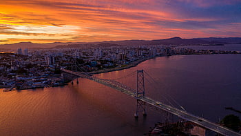 aerial view, suspension bridge, Floripa Brazil, Hercílio Luz Bridge, Florianópolis, sunset, cityscape, waterfront, urban skyline, architectural landmark, scenic landscape