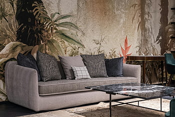 living room, contemporary sofa, floral wall design, stylish living room, cushions, modern furniture, interior design, decorative pillows, artistic wall, cozy living space, home decor