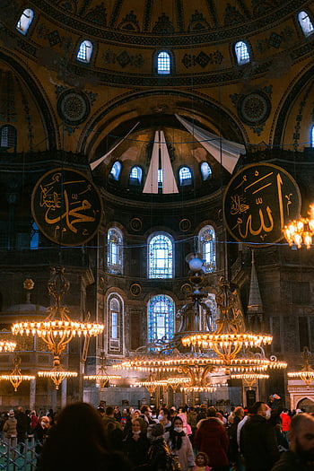 Hagia Sophia, interior view, Grand Mosque, chandeliers, visitors, stunning interior, historical architecture, religious site, Istanbul landmark, Turkish culture, ornate design