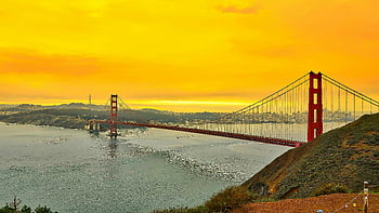 Golden Gate Bridge, San Francisco, California, sunset, vibrant sky, San Francisco Bay, stunning view, iconic landmark, city skyline, waterfront scenery, travel destination