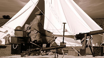 sepia photo, man military uniform, sitting near guns, white gazebo, vintage uniform, tent, military equipment, outdoors, soldier, military scene, historical reenactment