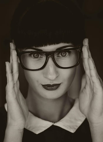 grayscale photography, woman wearing eyeglasses, black and white portrait, adjusting retro glasses, vintage style, striking portrait, eyeglasses, vintage glasses, black and white, woman portrait, retro style