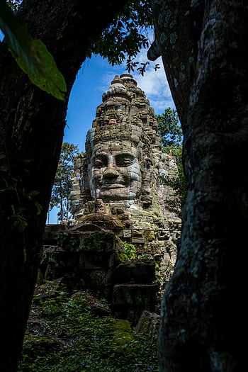 angkor wat, Kambodza, antiikin temppeli, matka-inspiraatiota, upea näkymä, puiden läpi, kivi kasvot, Historiallinen sivusto, luonnollinen kauneus, matkakohde, antiikin arkkitehtuuri
