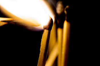 lighted matchstick, intense flame, dark background, close-up image, matchstick igniting, captivating photo, matchstick fire, burning matchstick, matchstick flame, matchstick photography, matchstick close-up